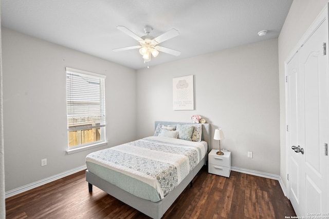 7635 Mission Smt, Boerne, TX 78015 - bedroom featuring a closet, baseboards, a ceiling fan, and wood finished floors