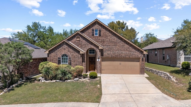 7635 Mission Smt, Boerne, TX 78015 - view of front of home featuring brick siding, a front lawn, a garage, and concrete driveway