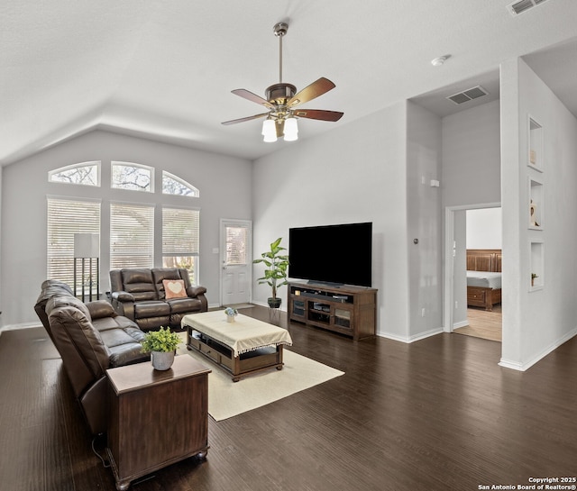 7635 Mission Smt, Boerne, TX 78015 - living area with ceiling fan, vaulted ceiling, dark wood finished floors, and visible vents