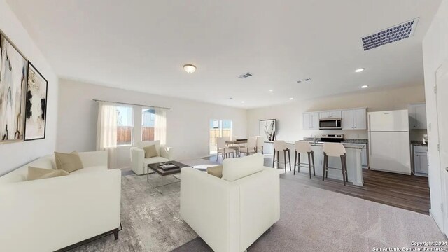 3219 Tumbleweed Hl, San Antonio, TX 78222 - living room featuring visible vents and recessed lighting