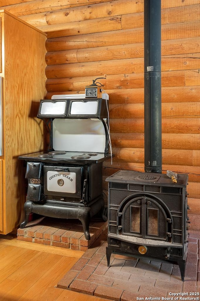 463 Woodland, Fredericksburg, TX 78624 - room details with rustic walls and a wood stove