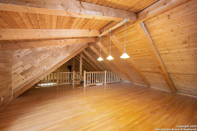 463 Woodland, Fredericksburg, TX 78624 - additional living space with wooden ceiling, vaulted ceiling with beams, and wood finished floors