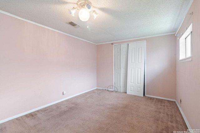 123 Haby Dr, San Antonio, TX 78212 - unfurnished bedroom with a textured ceiling, carpet flooring, crown molding, and a ceiling fan