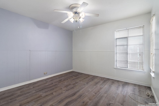 123 Haby Dr, San Antonio, TX 78212 - spare room featuring a wainscoted wall, a ceiling fan, wood finished floors, and baseboards
