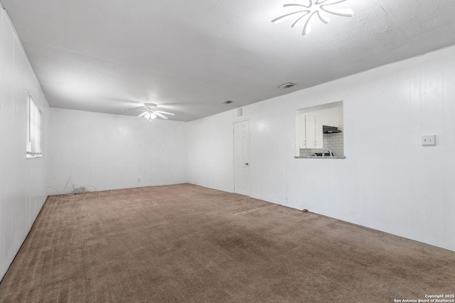 123 Haby Dr, San Antonio, TX 78212 - carpeted empty room with visible vents and a ceiling fan