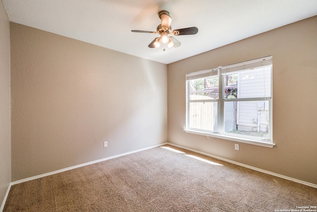 6611 Millrock, Live Oak, TX 78233 - unfurnished room with carpet flooring, ceiling fan, a textured wall, and baseboards