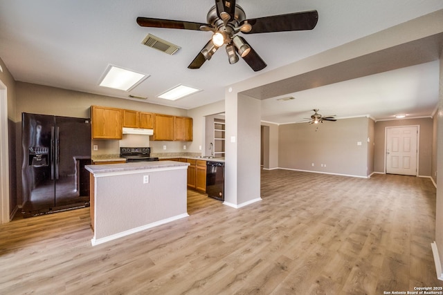 6611 Millrock, Live Oak, TX 78233 - kitchen featuring a ceiling fan, visible vents, black appliances, under cabinet range hood, and open floor plan