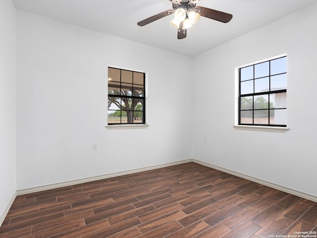 601 Wildflower Dr, Lytle, TX 78052 - spare room with wood finished floors, baseboards, and a ceiling fan