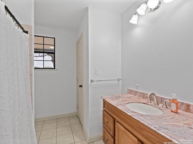601 Wildflower Dr, Lytle, TX 78052 - full bath with tile patterned floors, vanity, and baseboards