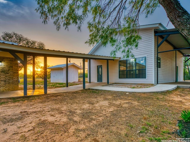 601 Wildflower Dr, Lytle, TX 78052 - back of property featuring a shed and an outdoor structure