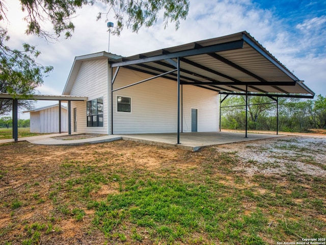 601 Wildflower Dr, Lytle, TX 78052 - exterior space with an attached carport