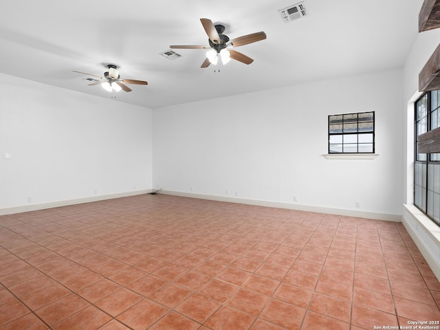 601 Wildflower Dr, Lytle, TX 78052 - spare room with baseboards, a ceiling fan, and visible vents