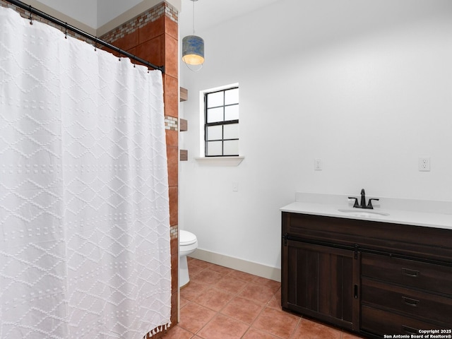 601 Wildflower Dr, Lytle, TX 78052 - full bath with vanity, a shower with curtain, tile patterned flooring, toilet, and baseboards