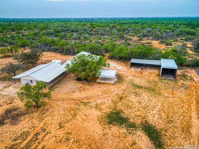 601 Wildflower Dr, Lytle, TX 78052 - birds eye view of property with a wooded view