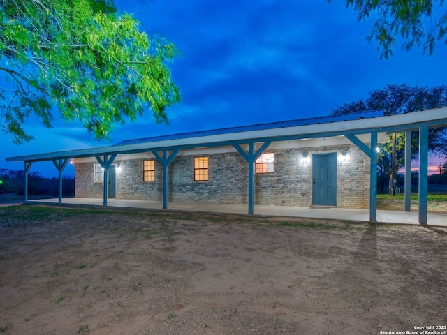 601 Wildflower Dr, Lytle, TX 78052 - view of home's exterior with metal roof