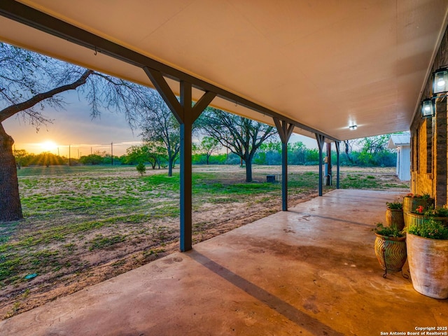 601 Wildflower Dr, Lytle, TX 78052 - view of patio terrace at dusk