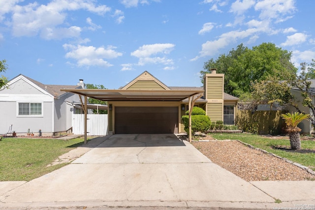 ranch-style home featuring a front lawn, fence, a garage, and concrete driveway