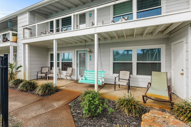71 W Nassau Unit 302, Rockport, TX 78382 - rear view of house with a patio area and a balcony