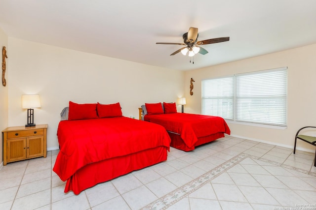 71 W Nassau Unit 302, Rockport, TX 78382 - bedroom featuring light tile patterned flooring, baseboards, and a ceiling fan