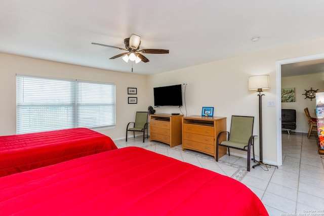 71 W Nassau Unit 302, Rockport, TX 78382 - tiled bedroom with baseboards and a ceiling fan