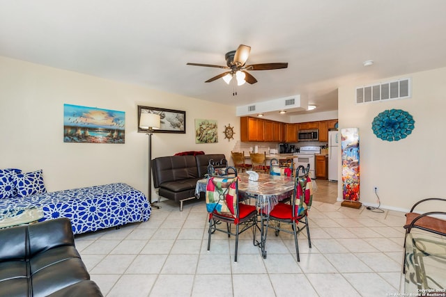 71 W Nassau Unit 302, Rockport, TX 78382 - dining area featuring visible vents, baseboards, a ceiling fan, and light tile patterned floors