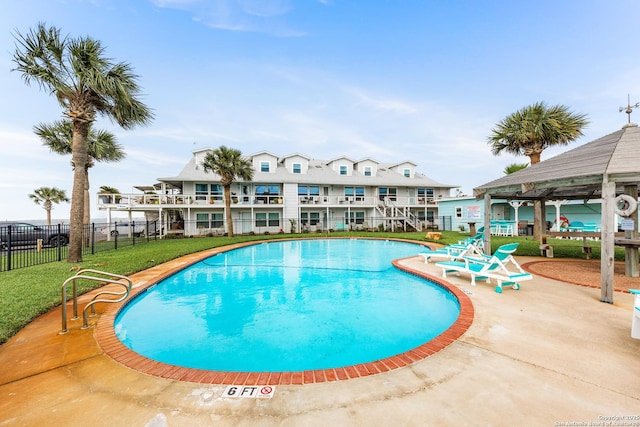 71 W Nassau Unit 302, Rockport, TX 78382 - pool with a yard and fence