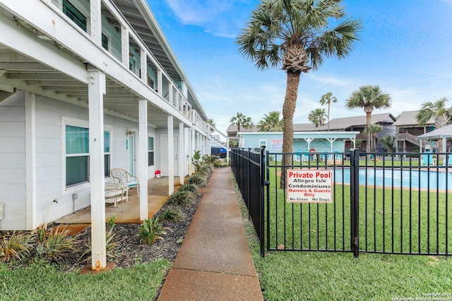 71 W Nassau Unit 302, Rockport, TX 78382 - exterior space featuring a yard and fence