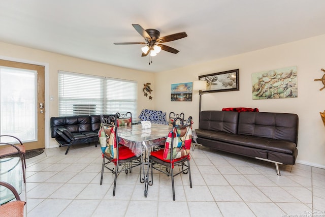 71 W Nassau Unit 302, Rockport, TX 78382 - dining room featuring light tile patterned floors, baseboards, and a ceiling fan