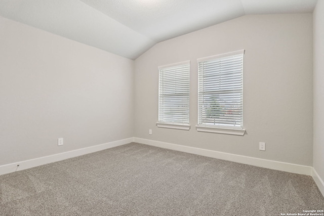 17110 Autry Fls, San Antonio, TX 78247 - spare room with vaulted ceiling and carpet
