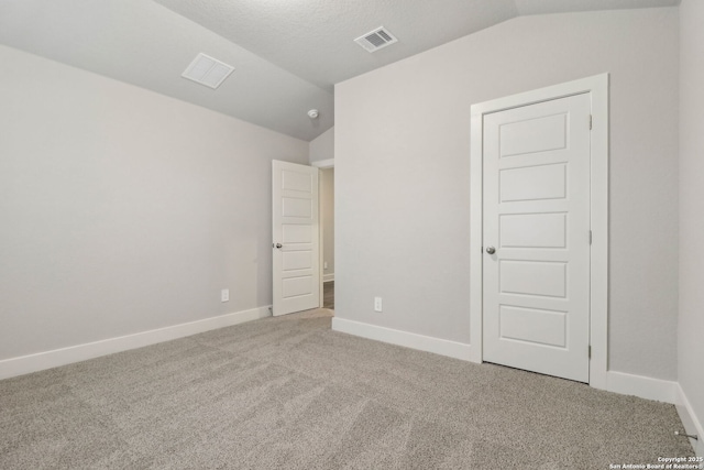 17110 Autry Fls, San Antonio, TX 78247 - unfurnished bedroom featuring vaulted ceiling and carpet floors