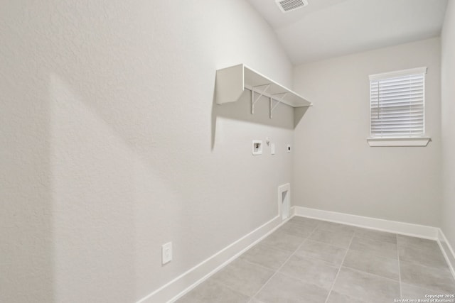 17110 Autry Fls, San Antonio, TX 78247 - laundry area featuring hookup for a washing machine, electric dryer hookup, hookup for a gas dryer, and light tile patterned flooring