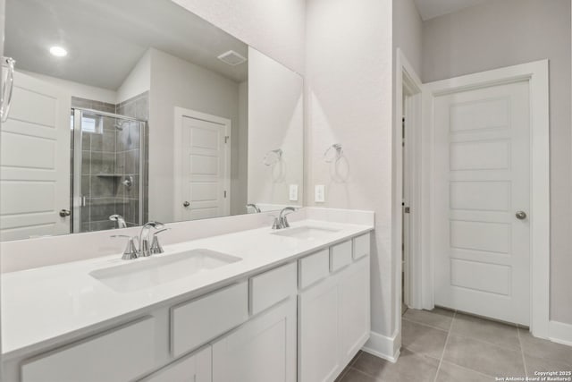 17110 Autry Fls, San Antonio, TX 78247 - bathroom featuring double vanity, a stall shower, and tile patterned flooring