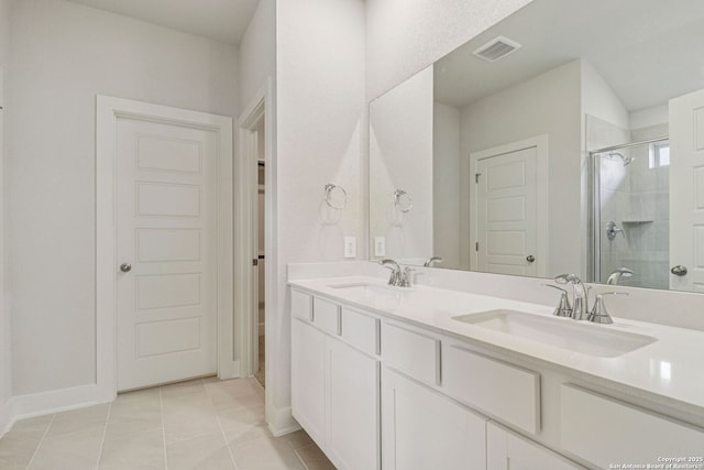 17114 Autry Fls, San Antonio, TX 78247 - bathroom featuring a shower stall, tile patterned flooring, and double vanity