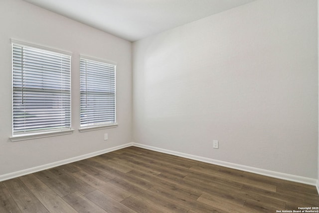 11534 Cottage Pt, San Antonio, TX 78254 - spare room featuring dark wood-style floors and baseboards