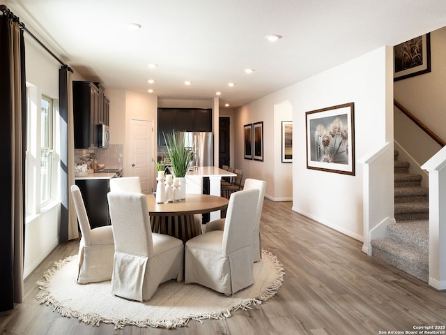 11534 Cottage Pt, San Antonio, TX 78254 - dining room with stairway, light wood-type flooring, and recessed lighting