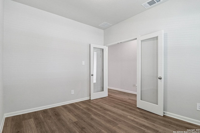 11534 Cottage Pt, San Antonio, TX 78254 - unfurnished bedroom featuring french doors and dark wood-style floors