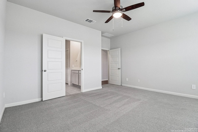 11534 Cottage Pt, San Antonio, TX 78254 - unfurnished bedroom with light colored carpet, ensuite bath, and a ceiling fan