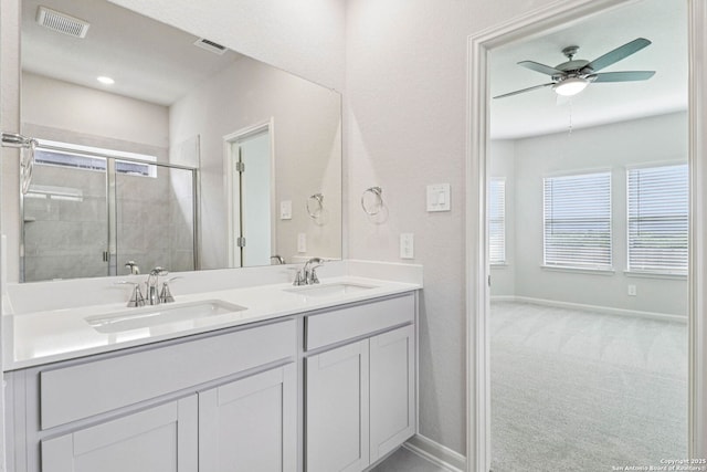 11534 Cottage Pt, San Antonio, TX 78254 - bathroom featuring double vanity, tiled shower, and a ceiling fan
