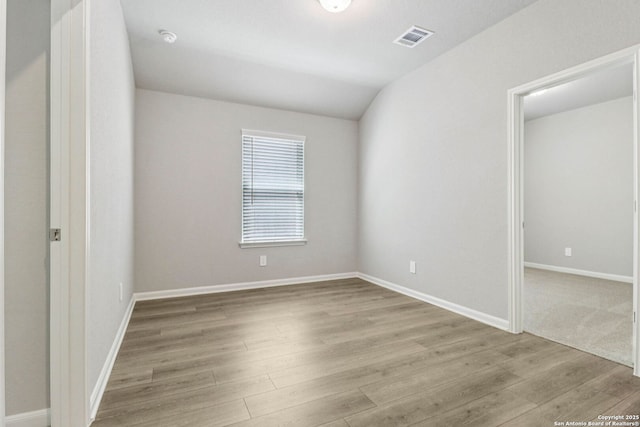 11538 Cottage Pt, San Antonio, TX 78254 - unfurnished bedroom with light wood-style floors and vaulted ceiling