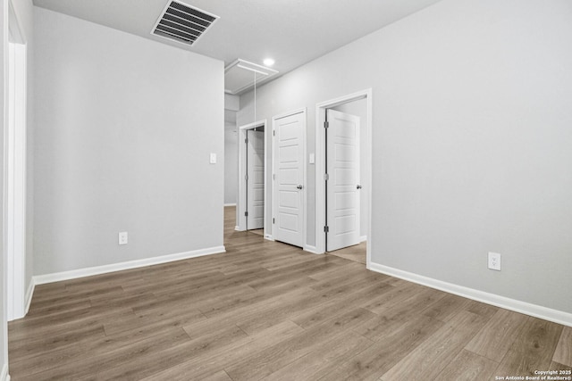 11538 Cottage Pt, San Antonio, TX 78254 - unfurnished bedroom featuring attic access, wood finished floors, and recessed lighting
