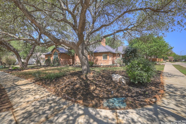 1780 Oak Frst, New Braunfels, TX 78132 - view of home's exterior featuring a chimney