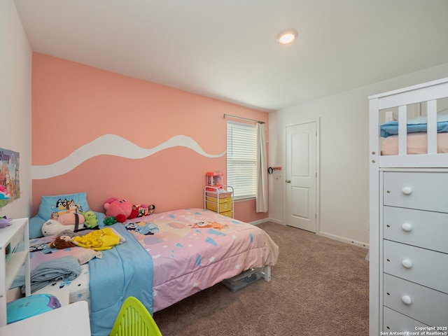 carpeted bedroom featuring baseboards