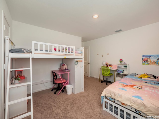 carpeted bedroom with visible vents and baseboards