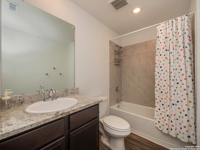 bathroom with toilet, shower / bath combo, wood finished floors, and visible vents