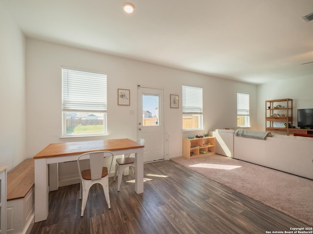 dining area featuring visible vents and dark wood finished floors