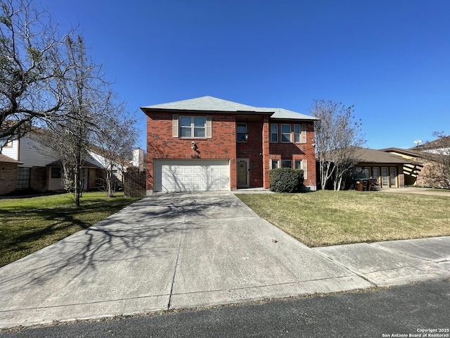 traditional home featuring brick siding, a front yard, a garage, and concrete driveway