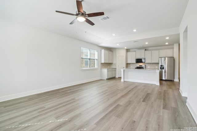 11530 Cottage Pt, San Antonio, TX 78254 - unfurnished living room featuring light wood-type flooring, recessed lighting, and a ceiling fan