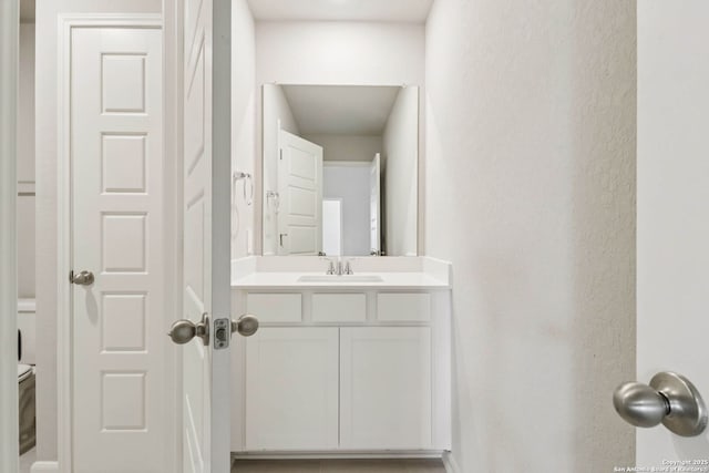 11530 Cottage Pt, San Antonio, TX 78254 - half bathroom with vanity and a textured wall
