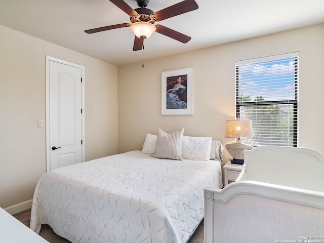 bedroom with baseboards and a ceiling fan