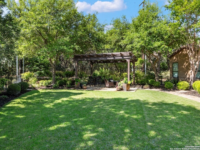 view of yard with a pergola and a patio